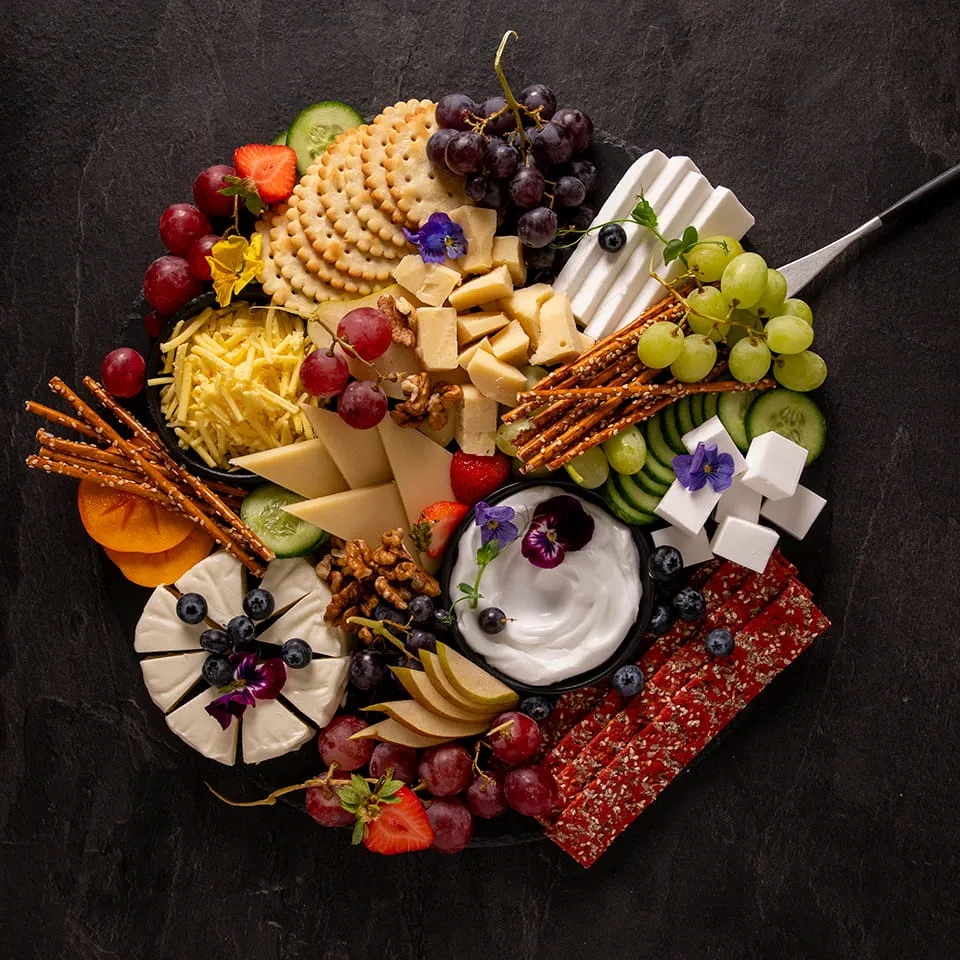 A platter made with Violife dairy free products, fruit and crackers