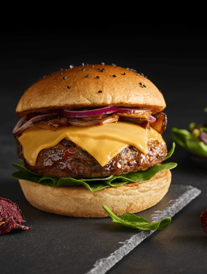 Plant-based burger served with Violife dairy-free cheese slices in a bun
